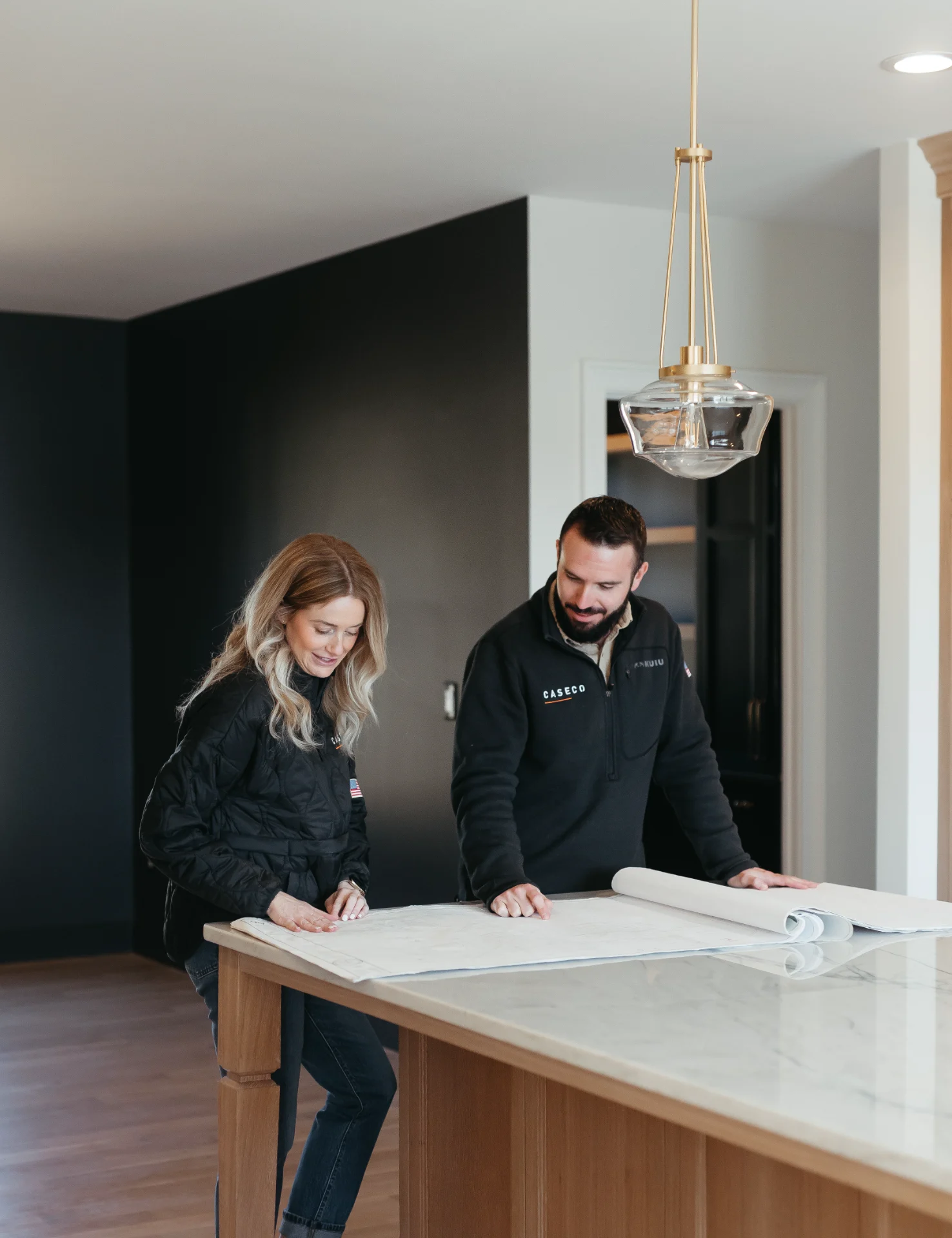 caseco-homes-virginia-custom-home-design-consultation-on-marble-kitchen-island