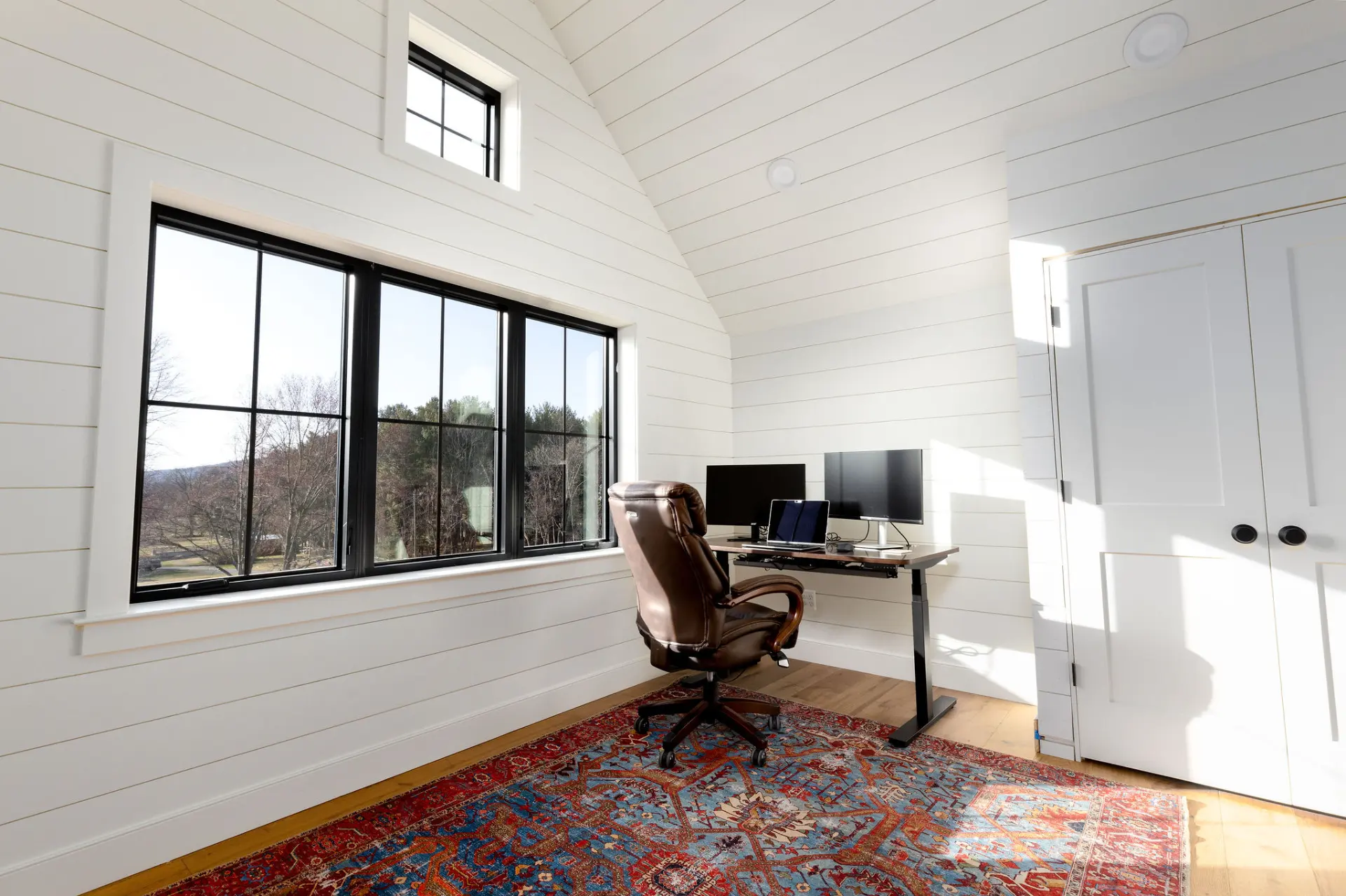 modern-home-office-with-white-shiplap-walls-and-black-grid-windows-virginia