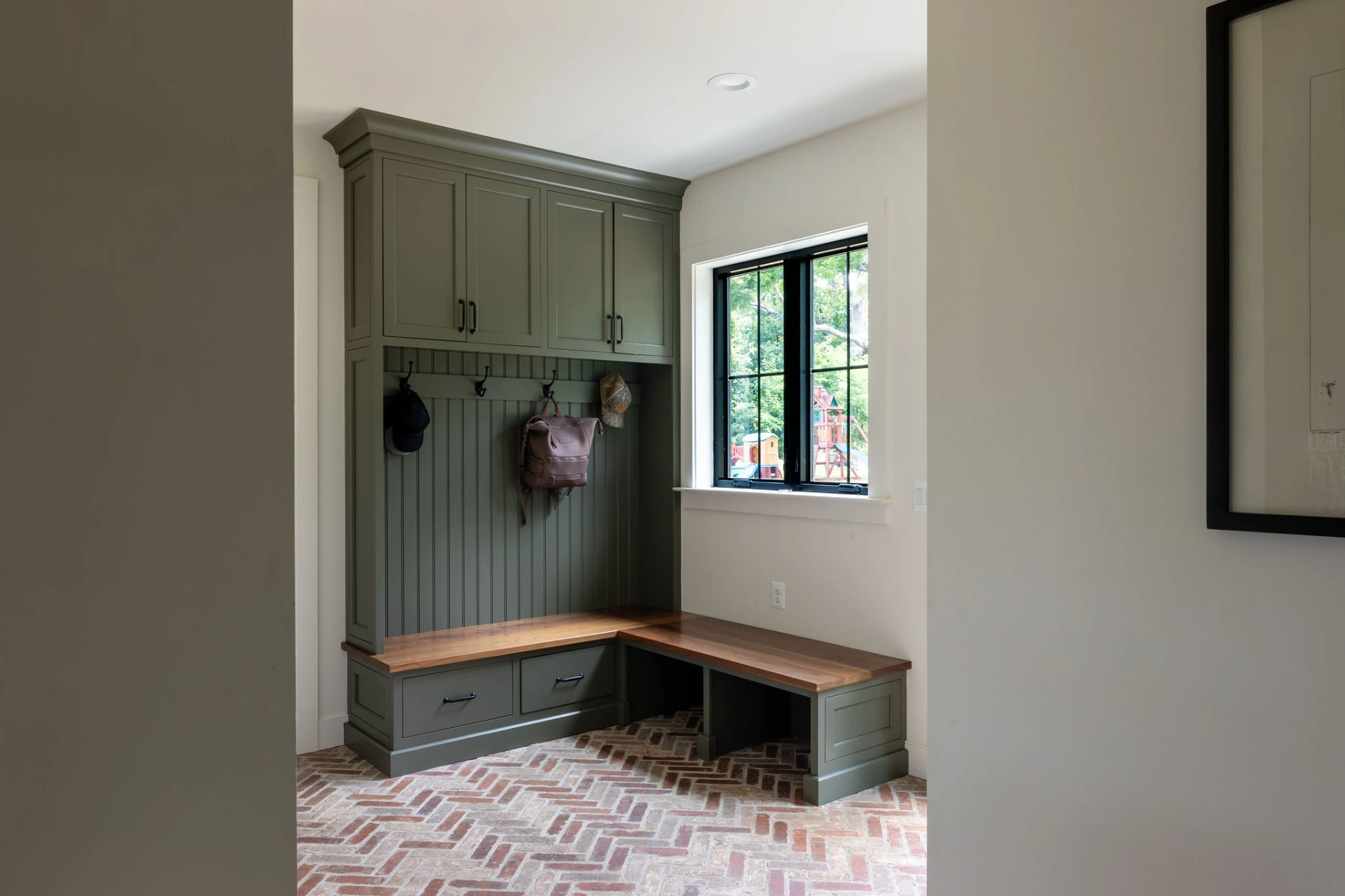 olive-green-mudroom-built-in-bench-round-hill-va-herringbone-brick-floor