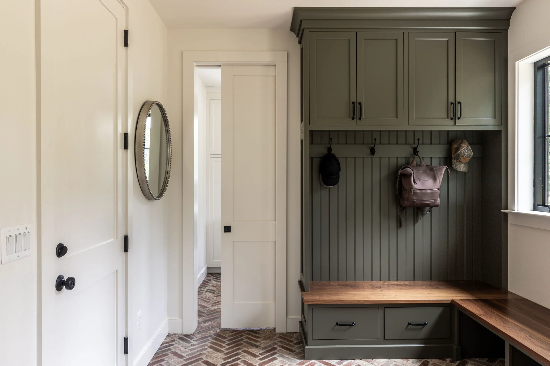 olive-green-mudroom-with-herringbone-brick-floor-round-hill-va