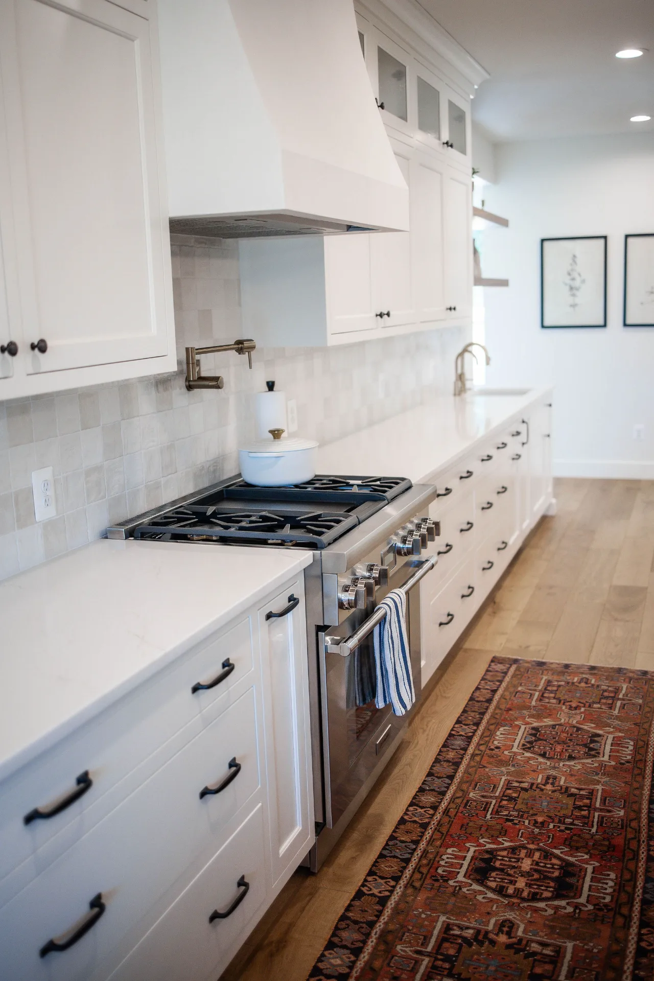 white-shaker-cabinet-kitchen-with-pot-filler-and-quartz-countertops-virginia
